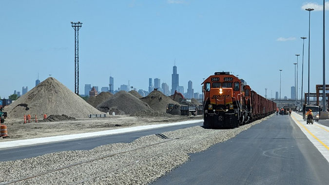 A train brings in ballast rock to support the construction of the new 4,530-foot production track. 